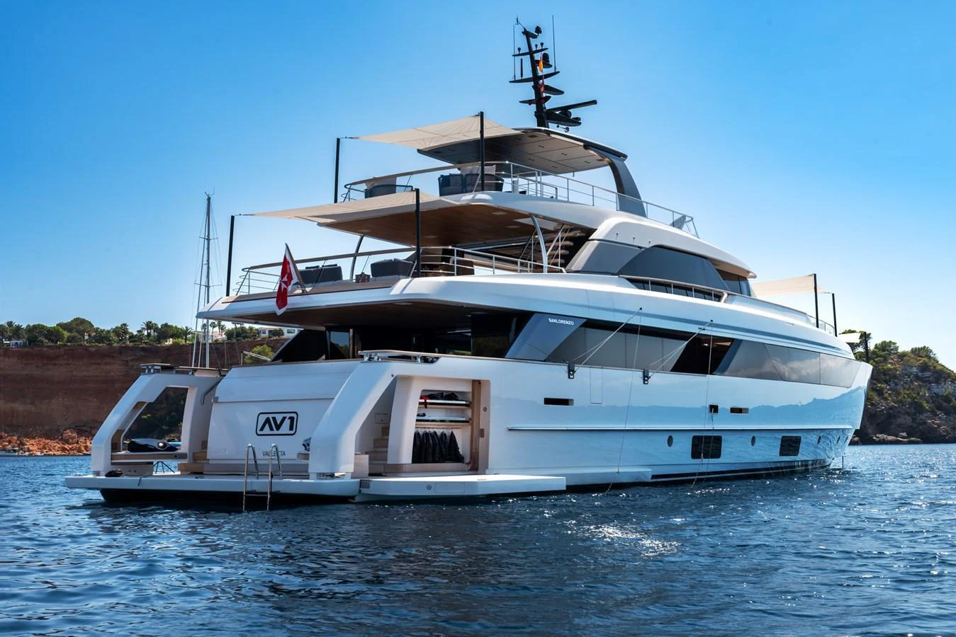 A luxurious yacht anchored in calm waters, showcasing its sleek design and multiple decks. aboard AV1 Yacht for Sale