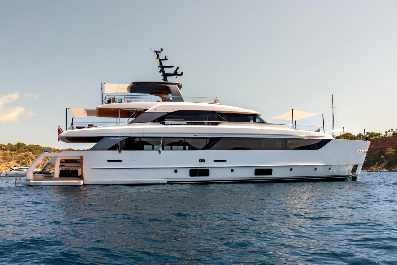 A sleek and modern yacht is anchored on calm waters, showcasing its elegant design and spacious decks. aboard AV1 Yacht for Sale