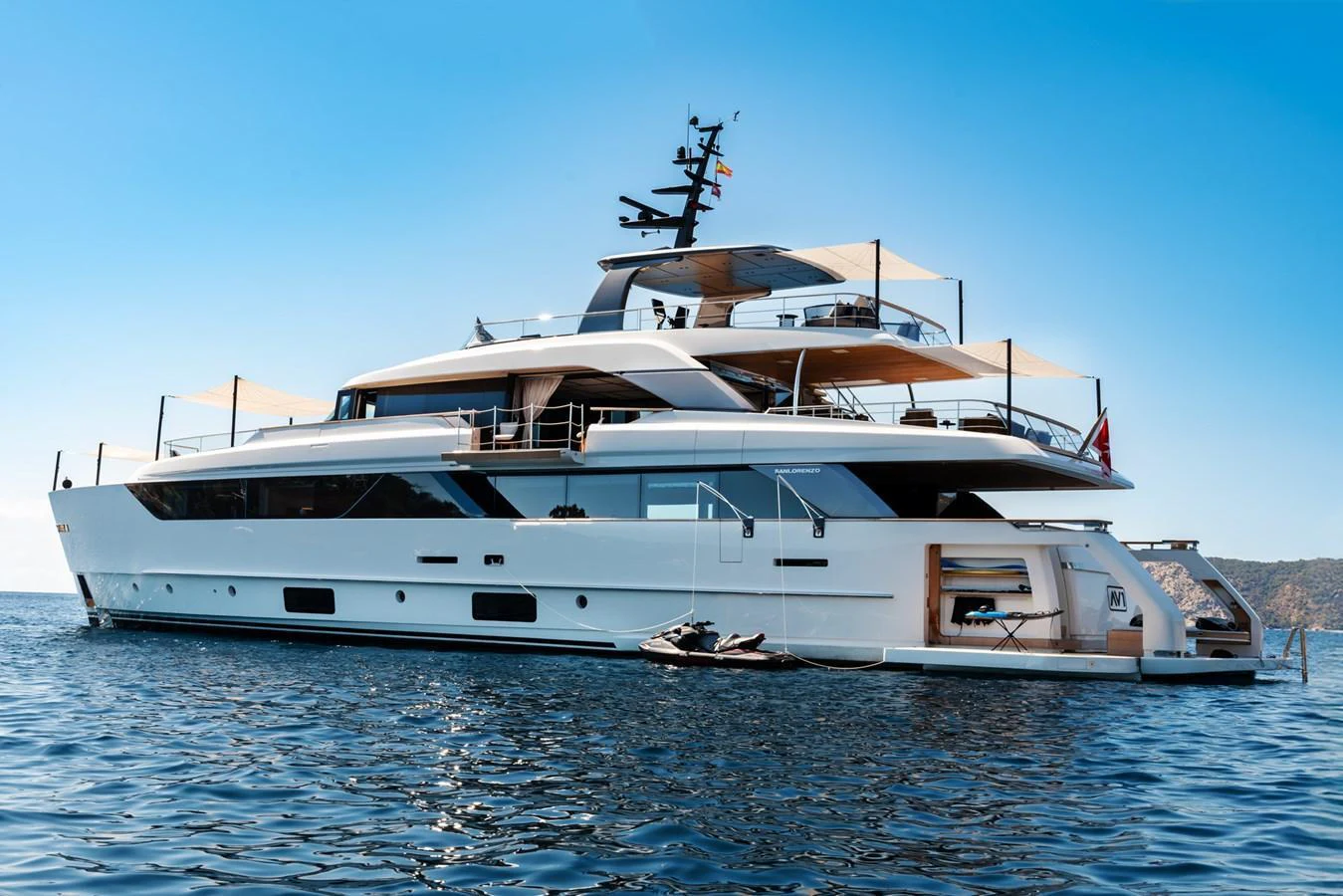 A sleek and modern yacht with multiple decks and luxurious amenities, anchored on calm waters. aboard AV1 Yacht for Sale