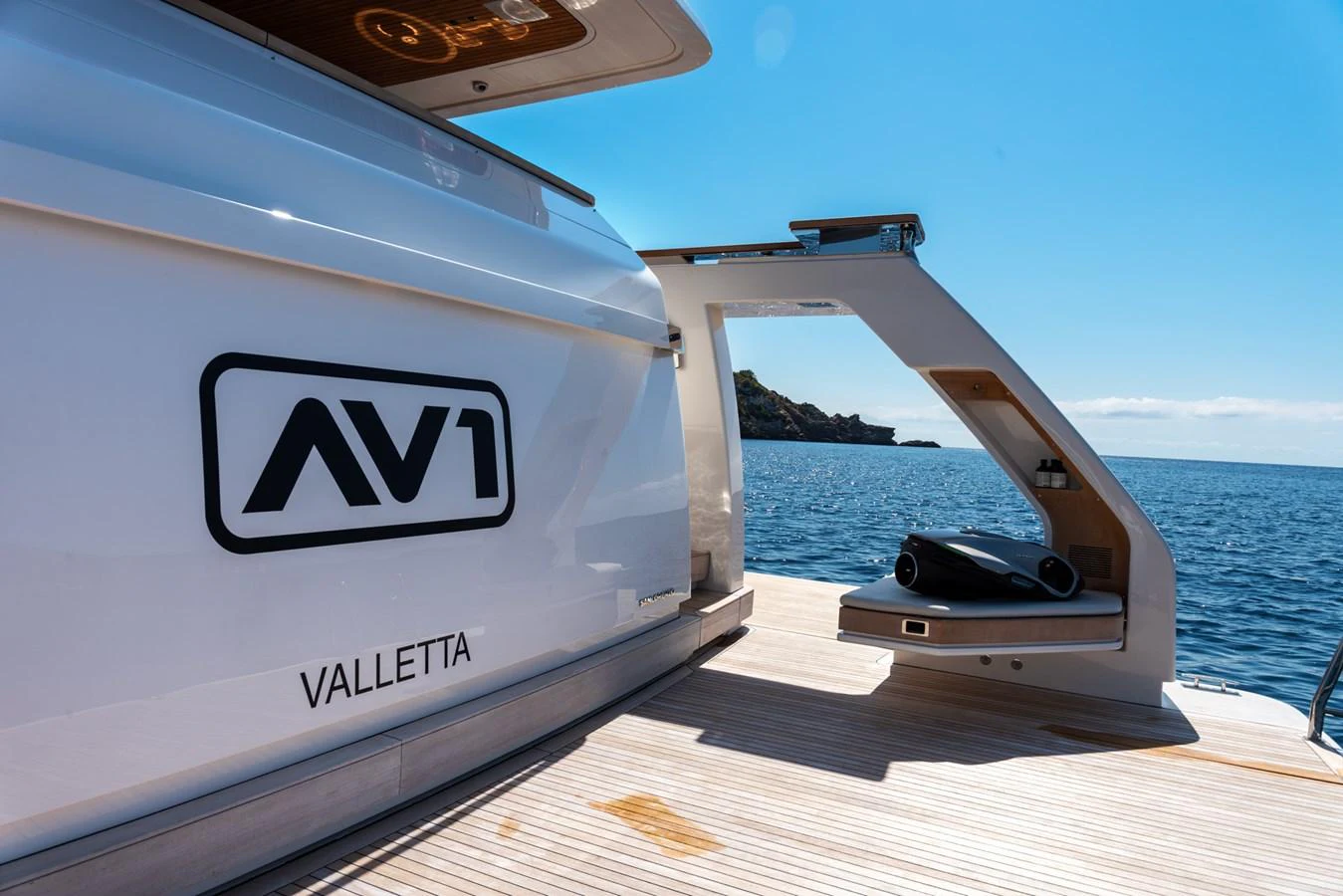 The aft deck of this yacht offers a sleek and modern design with a view of the open sea. aboard AV1 Yacht for Sale