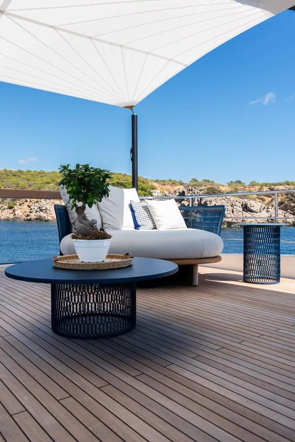 A stylish deck area with comfortable seating and a scenic ocean view. aboard AV1 Yacht for Sale