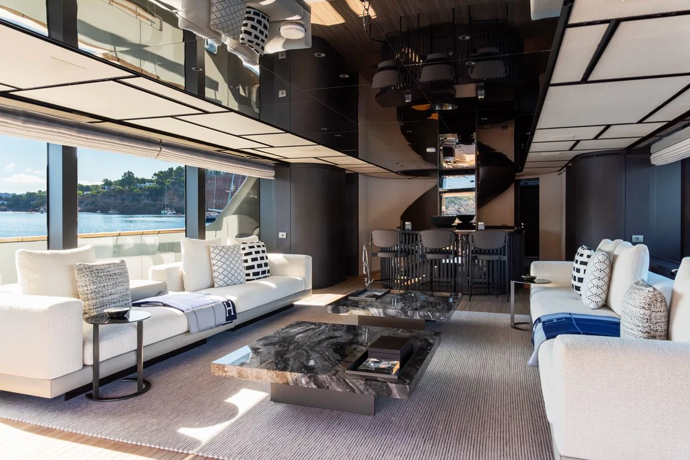 The yacht's salon features luxurious seating, modern decor, and expansive windows offering stunning views. aboard AV1 Yacht for Sale