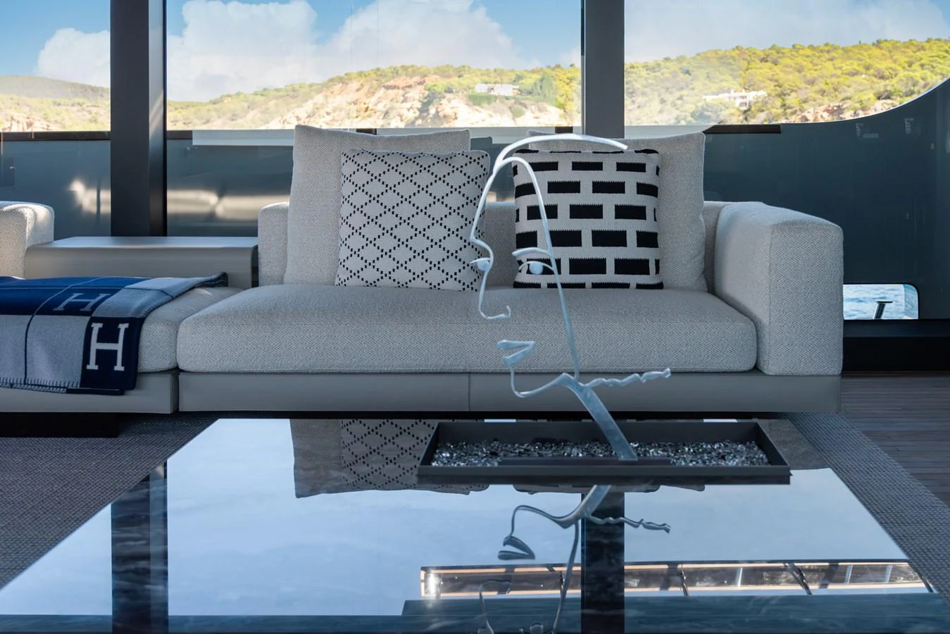 A stylish and modern lounge area with comfortable seating and artistic decor. aboard AV1 Yacht for Sale