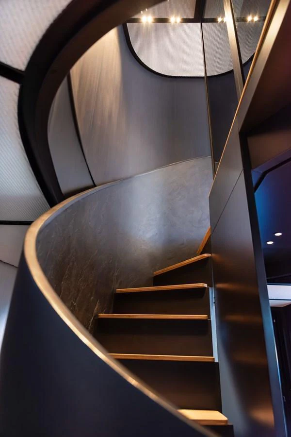 A sleek and modern interior staircase with elegant lighting. aboard AV1 Yacht for Sale