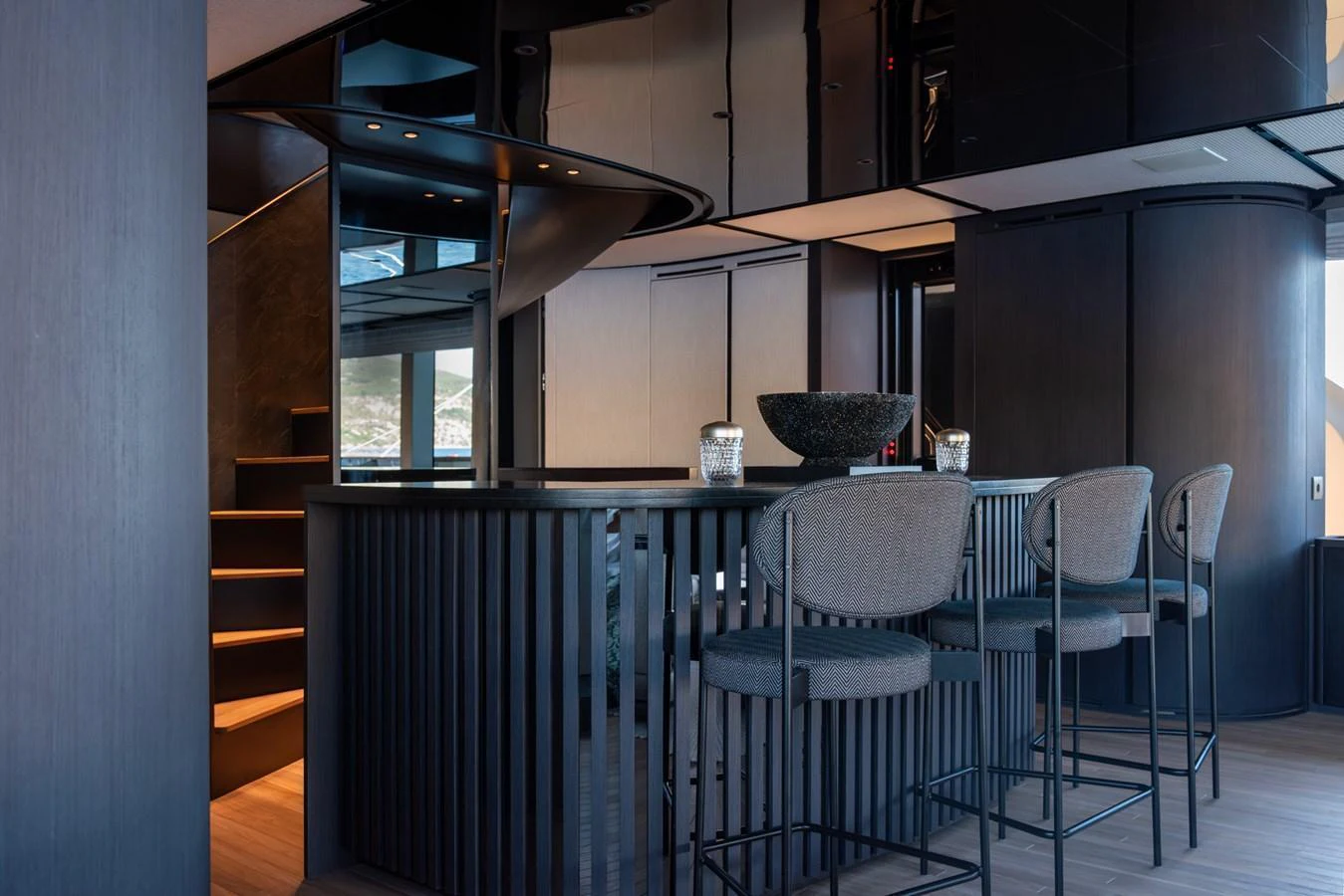 The yacht's interior features a sleek and modern bar area with stylish seating and elegant design. aboard AV1 Yacht for Sale