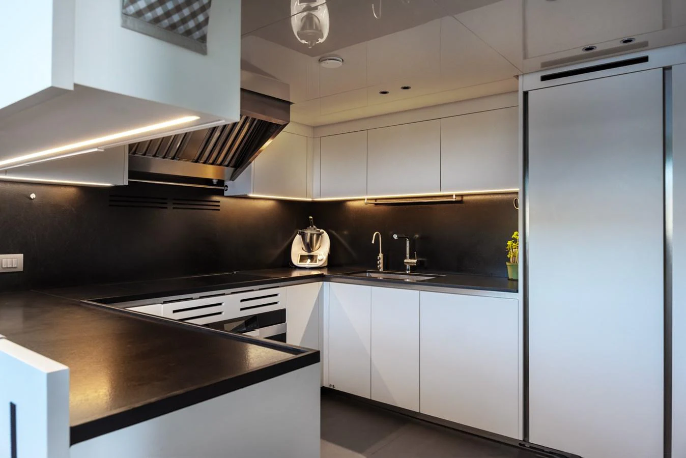 The yacht's galley features sleek, modern design with ample counter space and high-end appliances. aboard AV1 Yacht for Sale