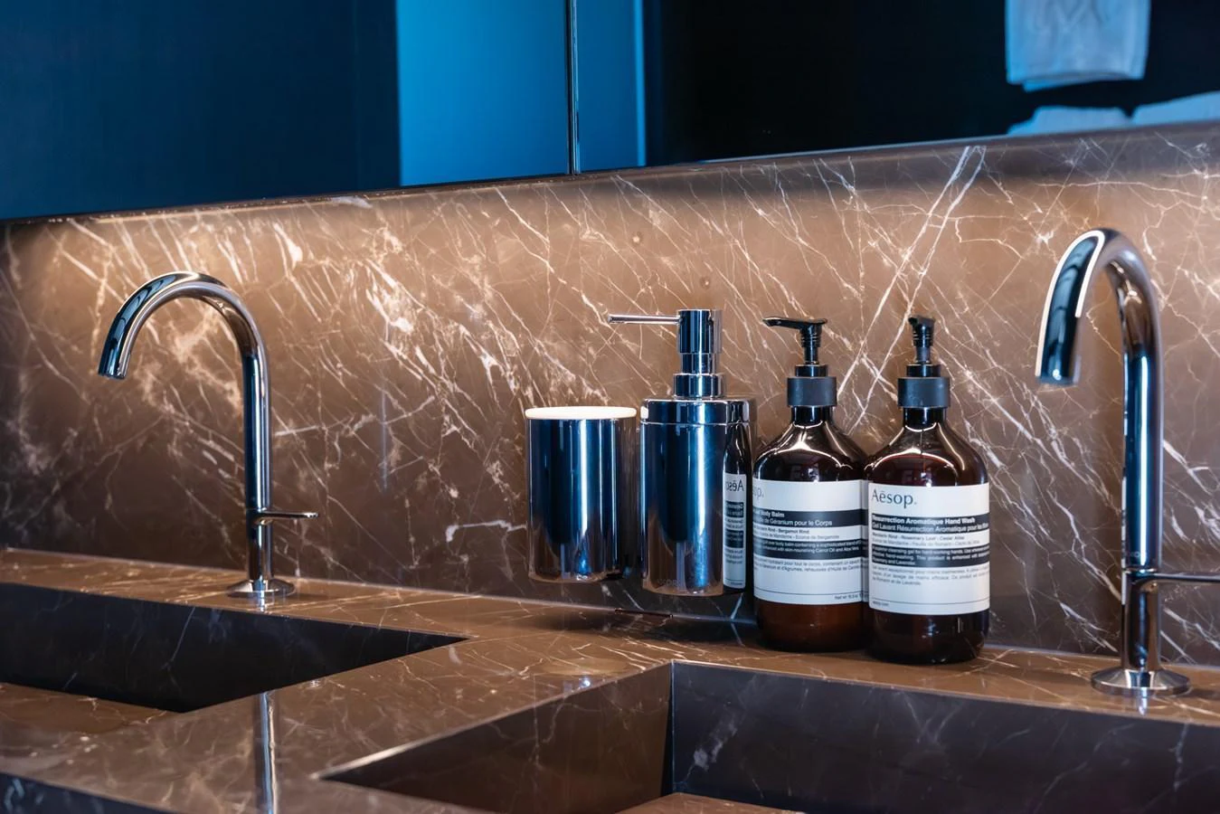 The yacht's bathroom features a luxurious marble countertop with modern fixtures and high-end toiletries. aboard AV1 Yacht for Sale
