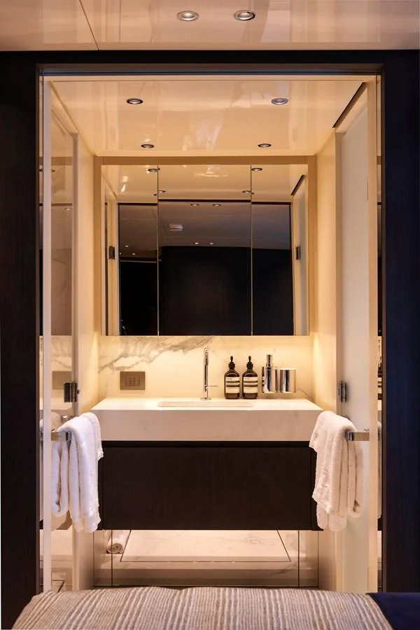 The yacht's bathroom features a sleek, modern design with elegant fixtures and ample lighting. aboard AV1 Yacht for Sale