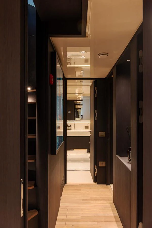 A sleek and modern hallway leading to a luxurious bathroom onboard the yacht. aboard AV1 Yacht for Sale