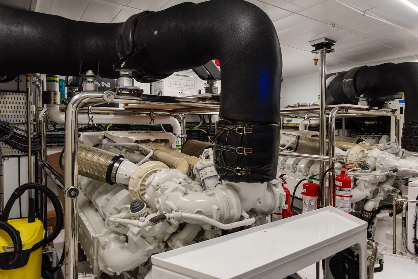 The image showcases the yacht's well-maintained engine room with advanced machinery and safety equipment. aboard AV1 Yacht for Sale