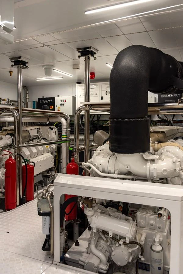 The image showcases the yacht's well-maintained engine room with advanced machinery and equipment. aboard AV1 Yacht for Sale