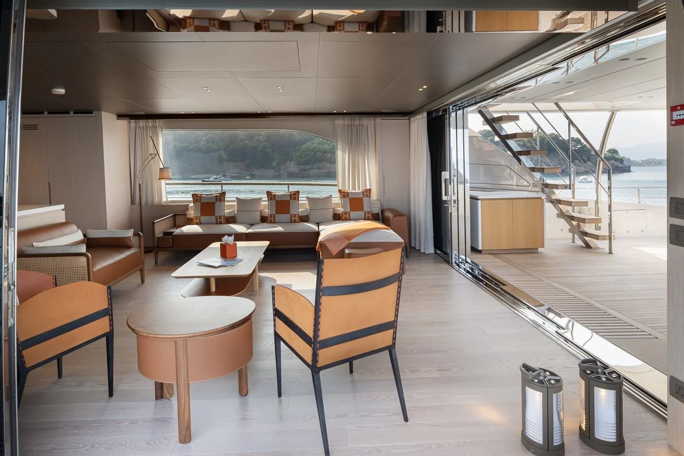 The spacious salon offers a seamless transition to the outdoor deck, featuring elegant furnishings and panoramic views. aboard LET IT BE Yacht for Sale
