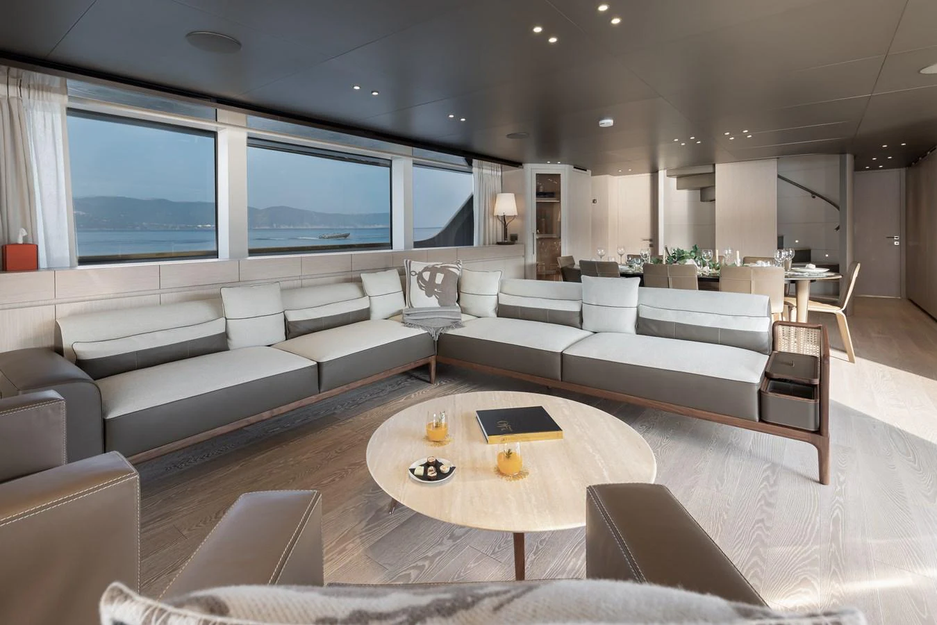 The spacious salon features modern furnishings and large windows offering stunning views. aboard LET IT BE Yacht for Sale