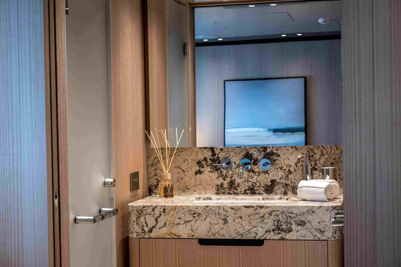 A luxurious yacht bathroom featuring a marble countertop and modern fixtures. aboard UNIQUE S Yacht for Sale
