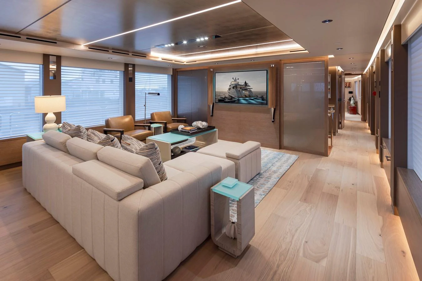 The salon features a spacious and modern design with comfortable seating and elegant decor. aboard WESTPORT 117 / 35M Yacht for Sale