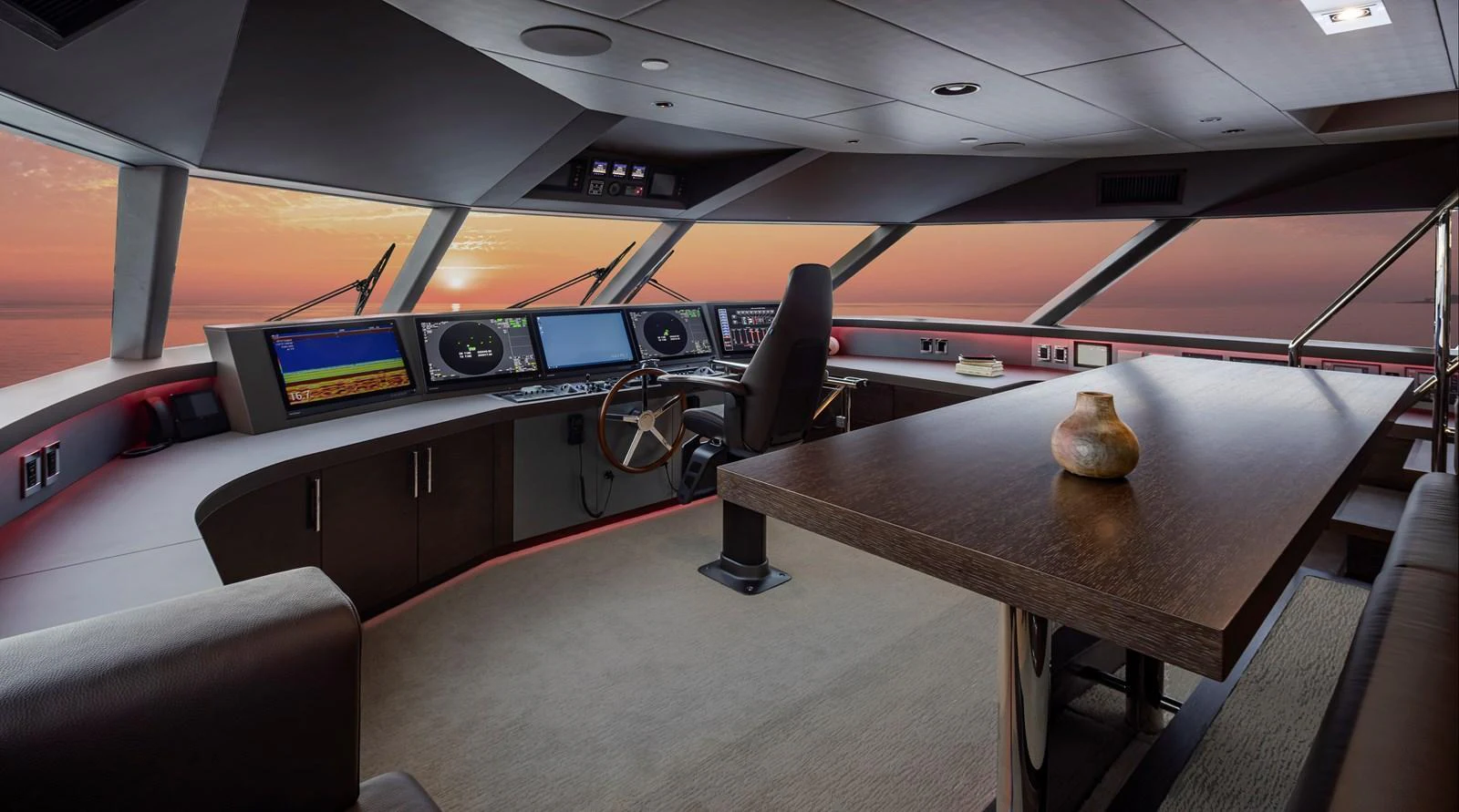 The helm station offers a panoramic view with state-of-the-art navigation equipment and luxurious seating. aboard WESTPORT 117 / 35M Yacht for Sale