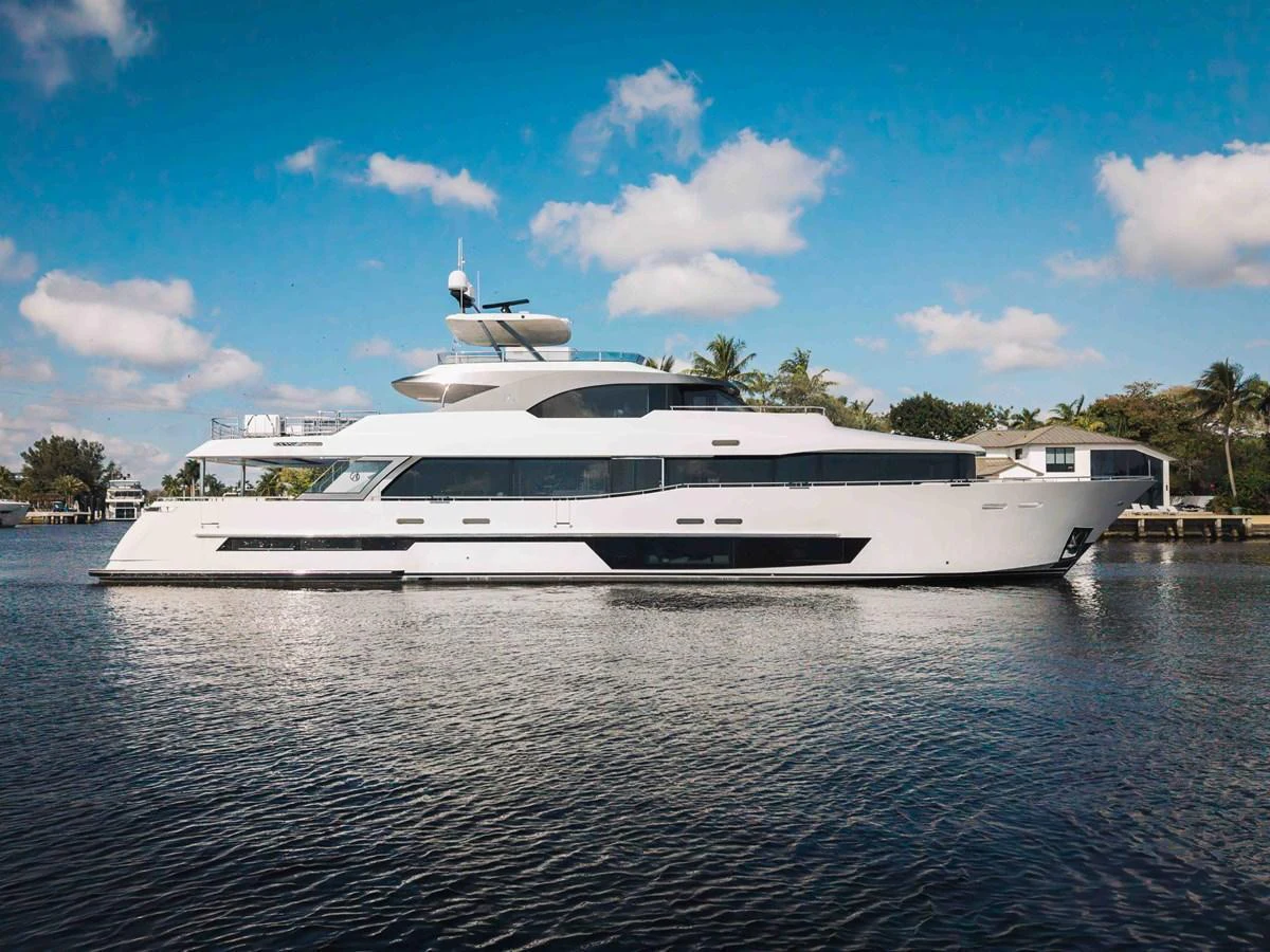 A sleek and modern yacht glides gracefully on calm waters under a clear blue sky. aboard OCEAN ALEXANDER 37L Yacht for Sale