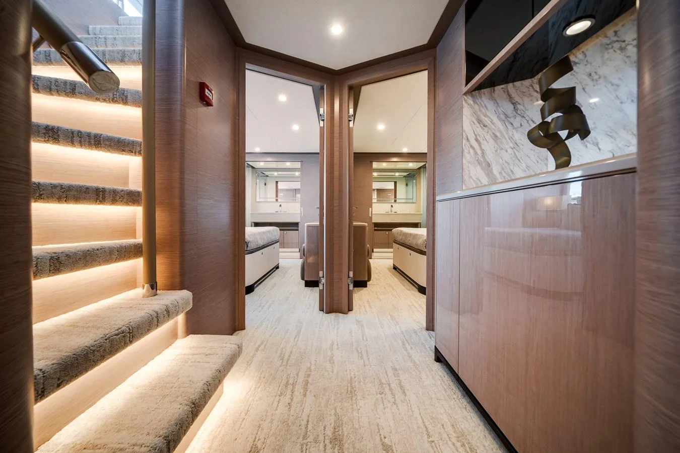 The yacht's interior features a modern and elegant hallway with luxurious finishes and ambient lighting. aboard OCEAN ALEXANDER 37L Yacht for Sale