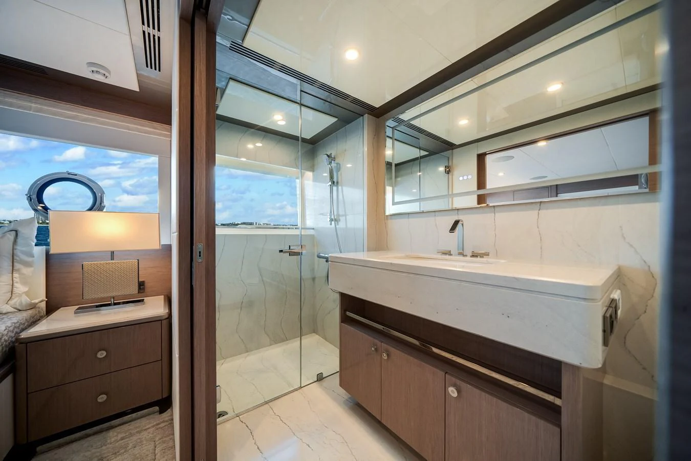 The yacht's bathroom features a sleek design with a spacious shower and modern fixtures. aboard OCEAN ALEXANDER 37L Yacht for Sale