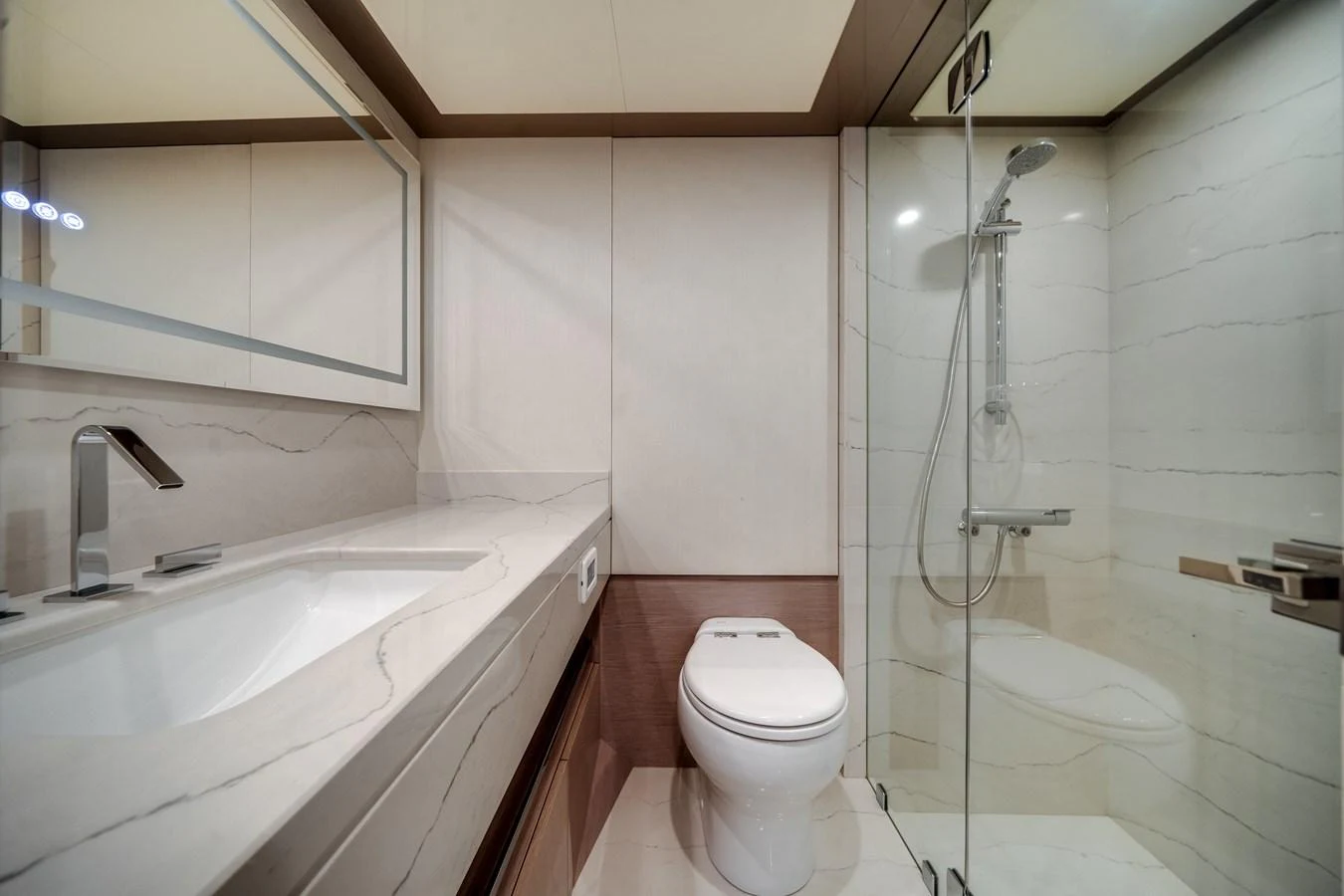 The yacht's bathroom features a sleek design with a modern shower and elegant fixtures. aboard OCEAN ALEXANDER 37L Yacht for Sale