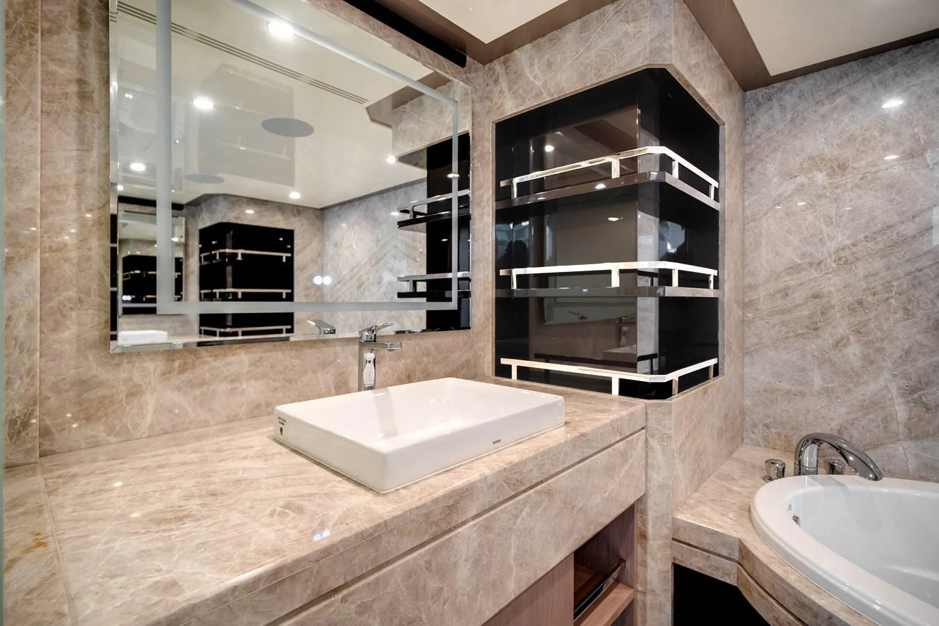 The yacht's bathroom features luxurious marble surfaces and modern fixtures. aboard OCEAN ALEXANDER 37L Yacht for Sale