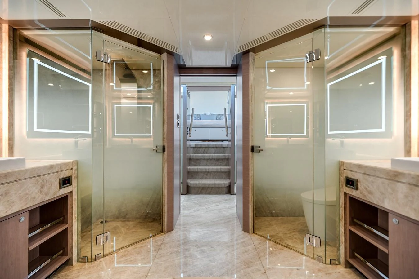 The yacht's interior features a luxurious bathroom with dual glass-enclosed showers and elegant marble finishes. aboard OCEAN ALEXANDER 37L Yacht for Sale