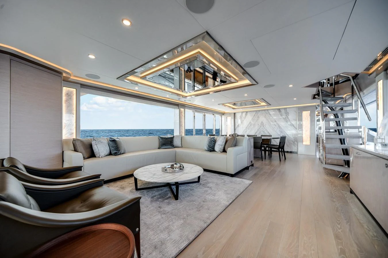 The spacious salon features modern furnishings and expansive ocean views. aboard OCEAN ALEXANDER 37L Yacht for Sale