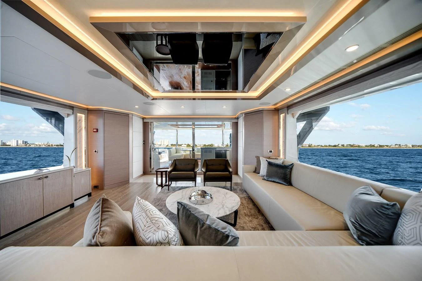 The salon offers a spacious and luxurious seating area with panoramic views of the sea. aboard OCEAN ALEXANDER 37L Yacht for Sale