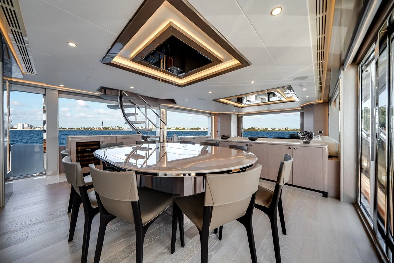 The yacht's dining area features a modern design with panoramic views and elegant furnishings. aboard OCEAN ALEXANDER 37L Yacht for Sale