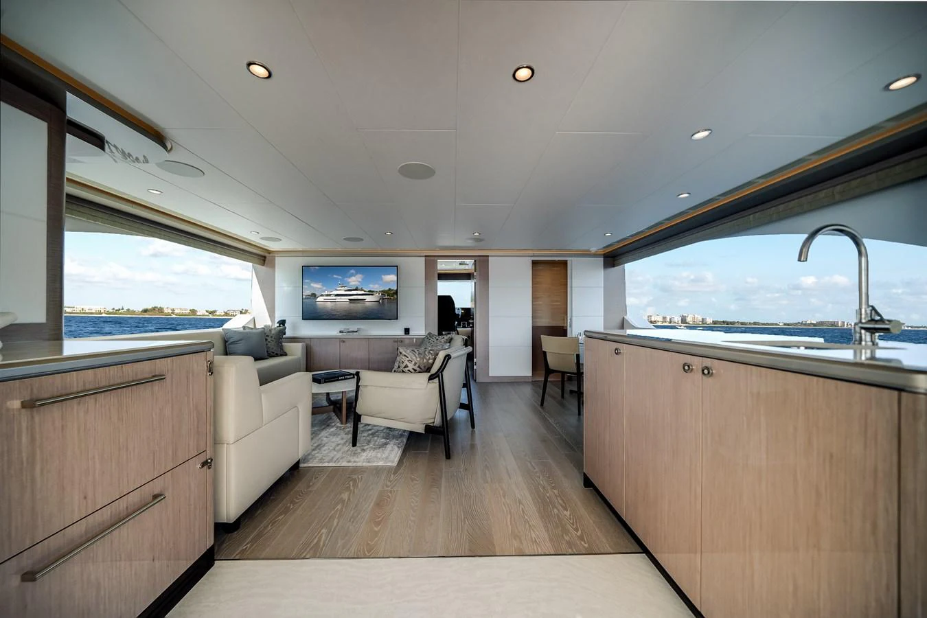 The yacht's salon offers a spacious and modern living area with panoramic views. aboard OCEAN ALEXANDER 37L Yacht for Sale