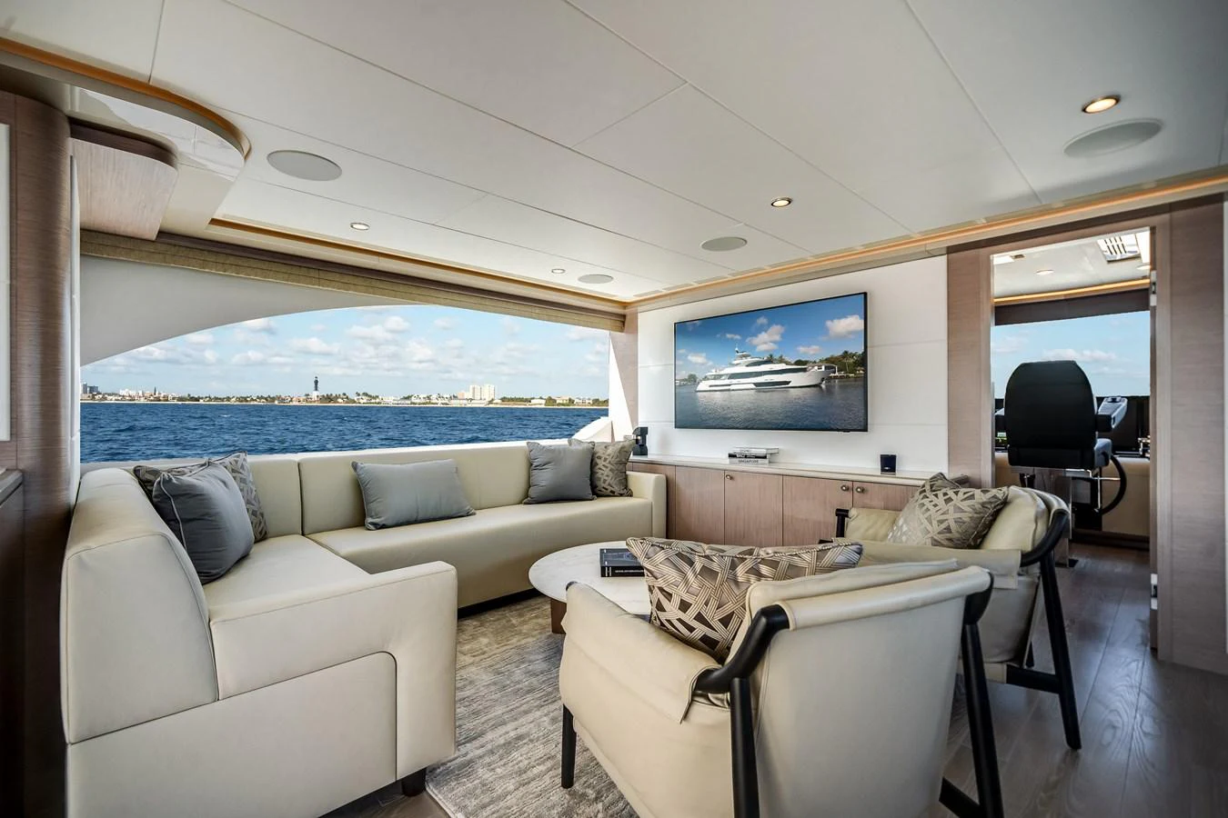 The salon offers a spacious and luxurious seating area with panoramic views of the sea. aboard OCEAN ALEXANDER 37L Yacht for Sale