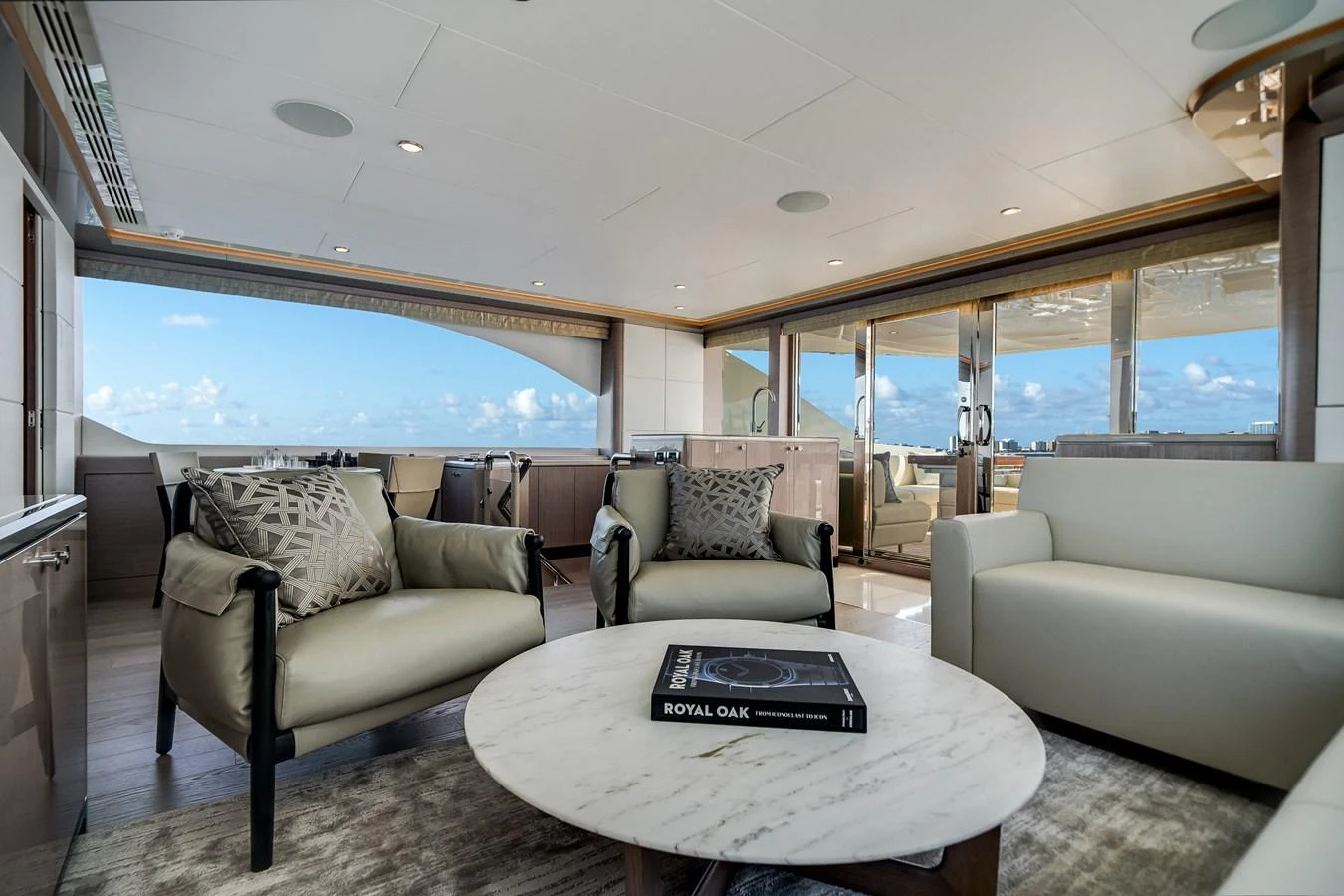 The salon offers a spacious and elegant seating area with panoramic views. aboard OCEAN ALEXANDER 37L Yacht for Sale