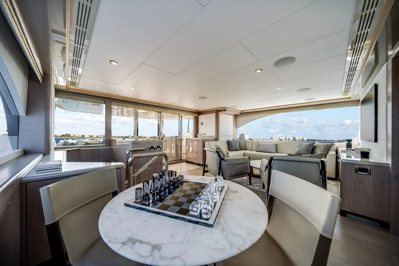 The salon offers a spacious and elegant area with panoramic views and luxurious seating. aboard OCEAN ALEXANDER 37L Yacht for Sale