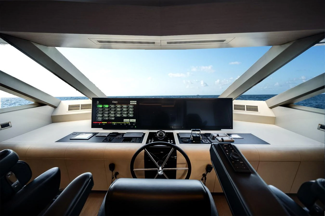 The helm offers a commanding view with state-of-the-art navigation equipment and luxurious seating. aboard OCEAN ALEXANDER 37L Yacht for Sale