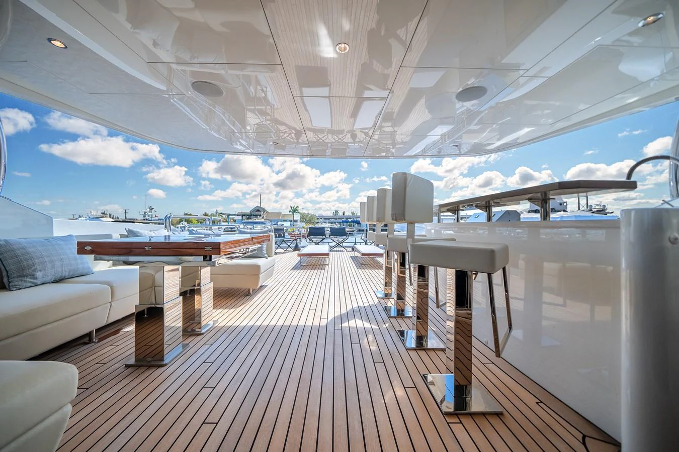 The aft deck offers a spacious and luxurious outdoor area with comfortable seating and a bar, perfect for relaxation and socializing. aboard OCEAN ALEXANDER 37L Yacht for Sale