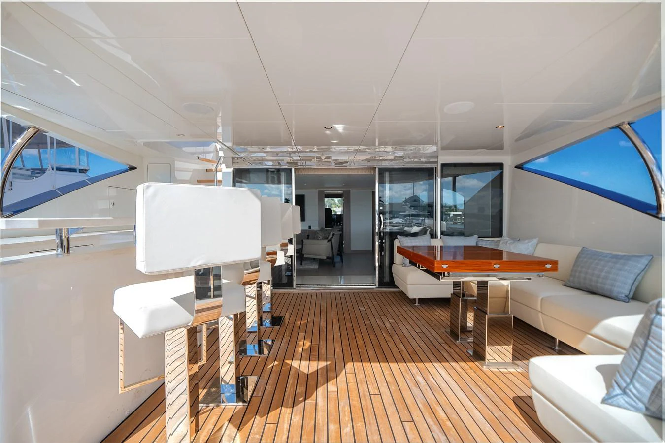 The aft deck features a spacious seating area with modern furnishings and ample natural light. aboard OCEAN ALEXANDER 37L Yacht for Sale