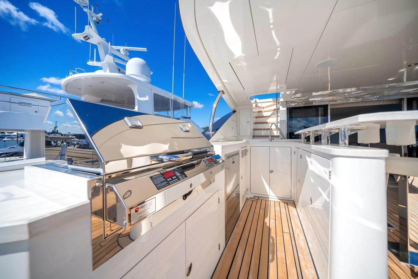 The yacht features a sleek outdoor galley with modern appliances and ample counter space, perfect for alfresco dining. aboard OCEAN ALEXANDER 37L Yacht for Sale