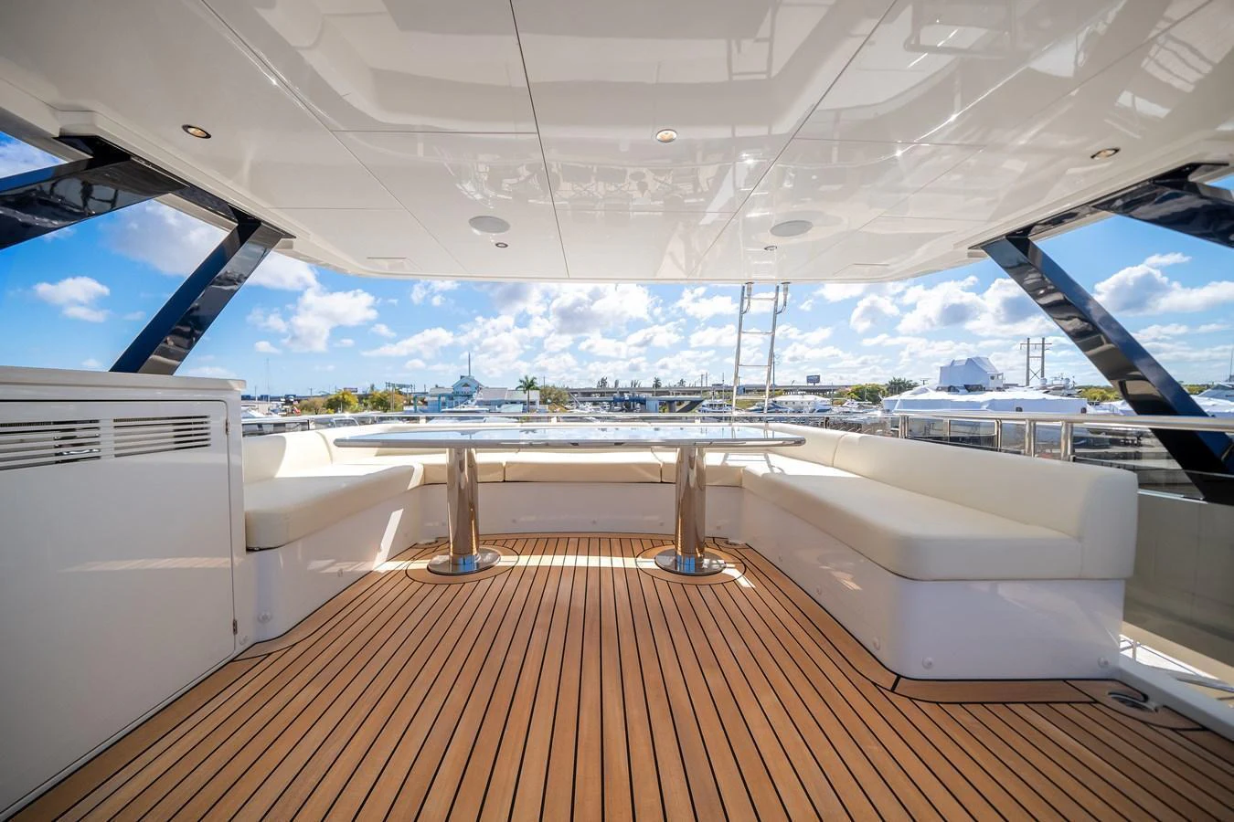 The flybridge offers a spacious and elegant area for relaxation with comfortable seating and a stunning view. aboard OCEAN ALEXANDER 37L Yacht for Sale