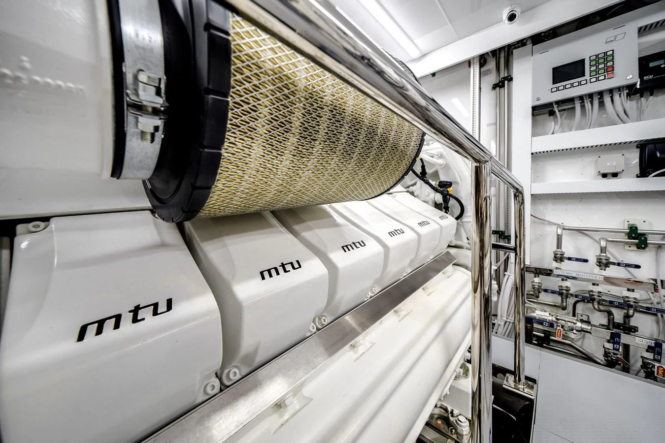 The image showcases a pristine engine room with advanced machinery and equipment. aboard OCEAN ALEXANDER 37L Yacht for Sale