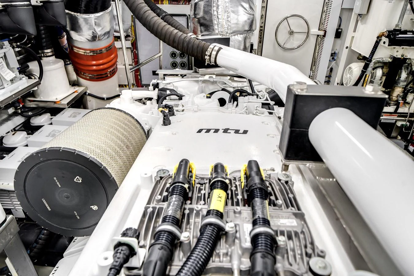The image showcases the intricate and well-maintained engine room of the yacht. aboard OCEAN ALEXANDER 37L Yacht for Sale