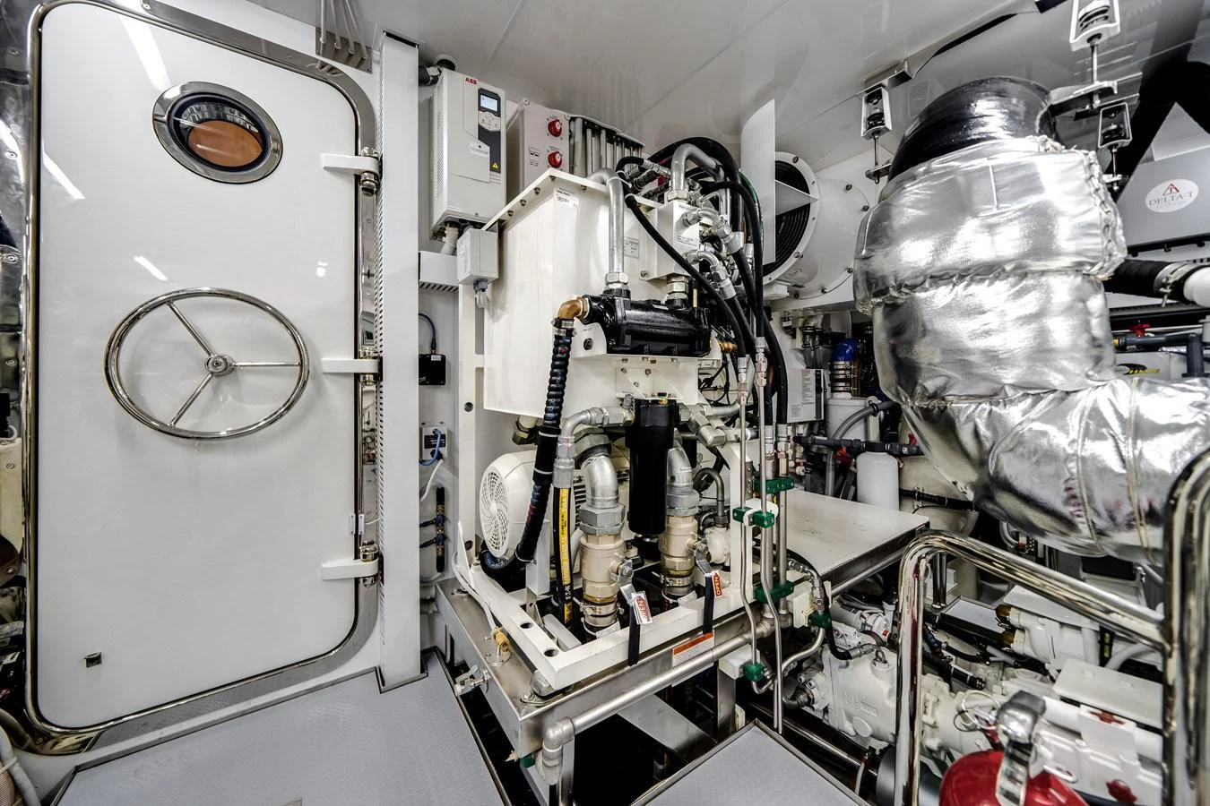 The image showcases the yacht's well-maintained engine room with advanced machinery and equipment. aboard OCEAN ALEXANDER 37L Yacht for Sale