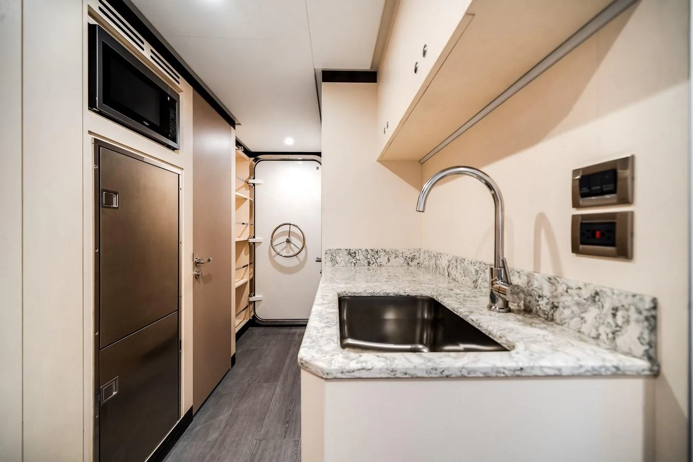The yacht's galley features modern appliances and a sleek design, perfect for onboard culinary experiences. aboard OCEAN ALEXANDER 37L Yacht for Sale