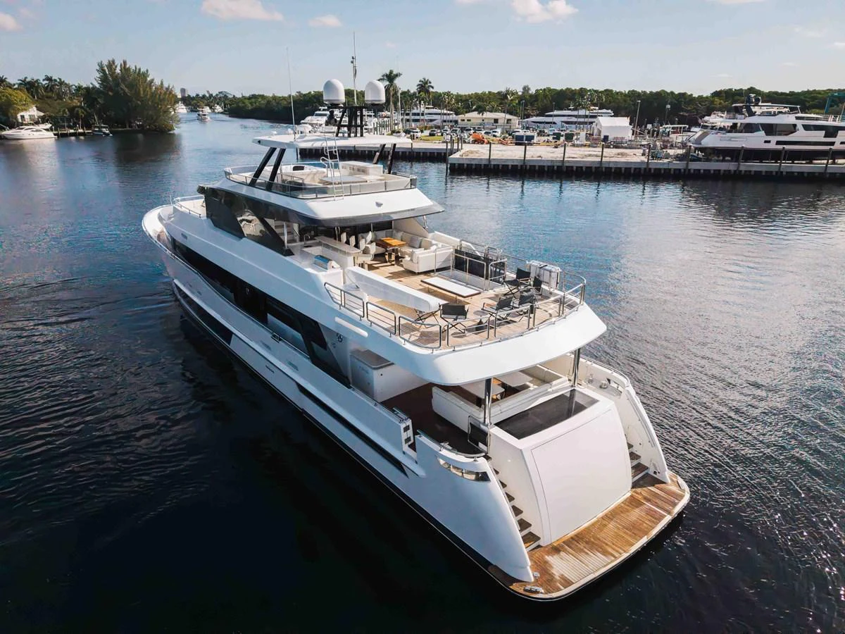 A sleek and modern yacht cruising through a serene marina with luxurious amenities on display. aboard OCEAN ALEXANDER 37L Yacht for Sale