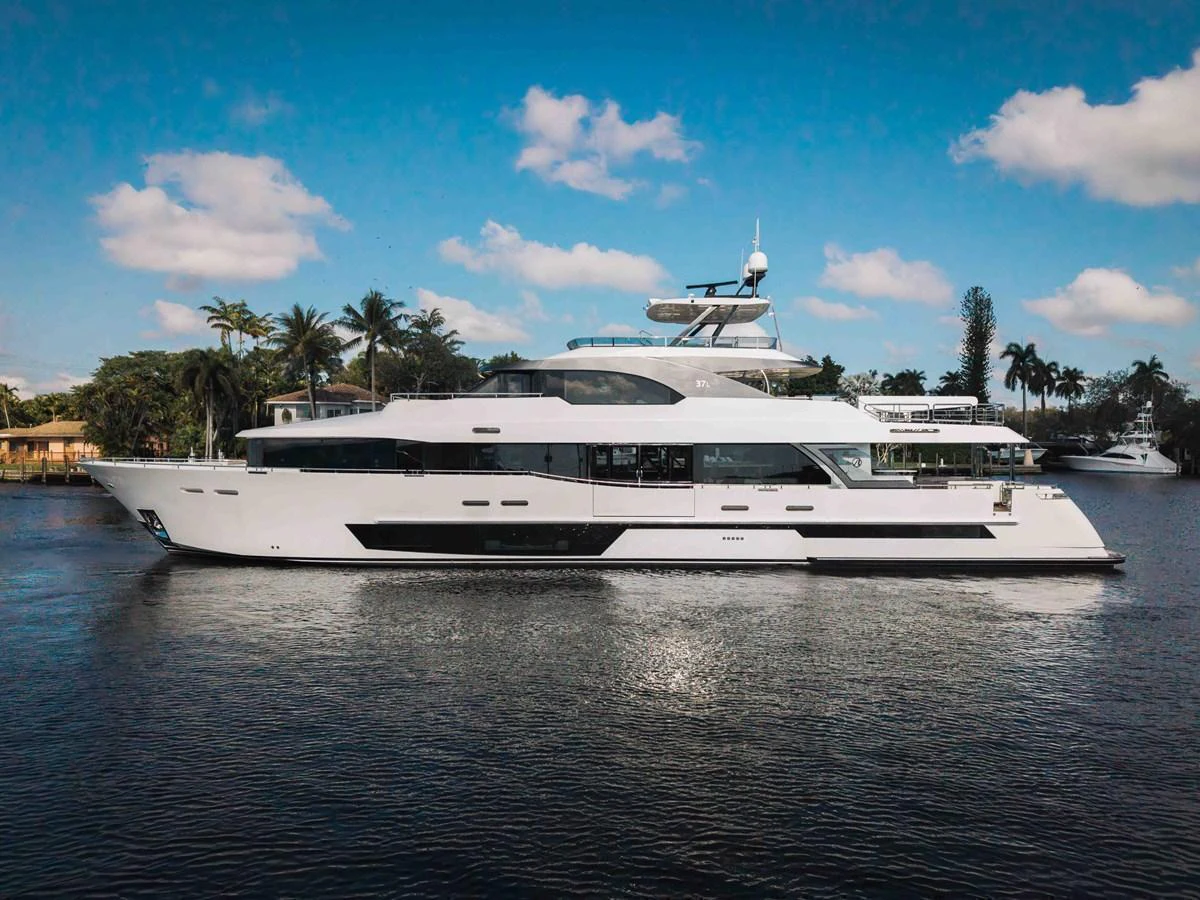 A sleek and modern yacht cruising on calm waters under a clear blue sky. aboard OCEAN ALEXANDER 37L Yacht for Sale