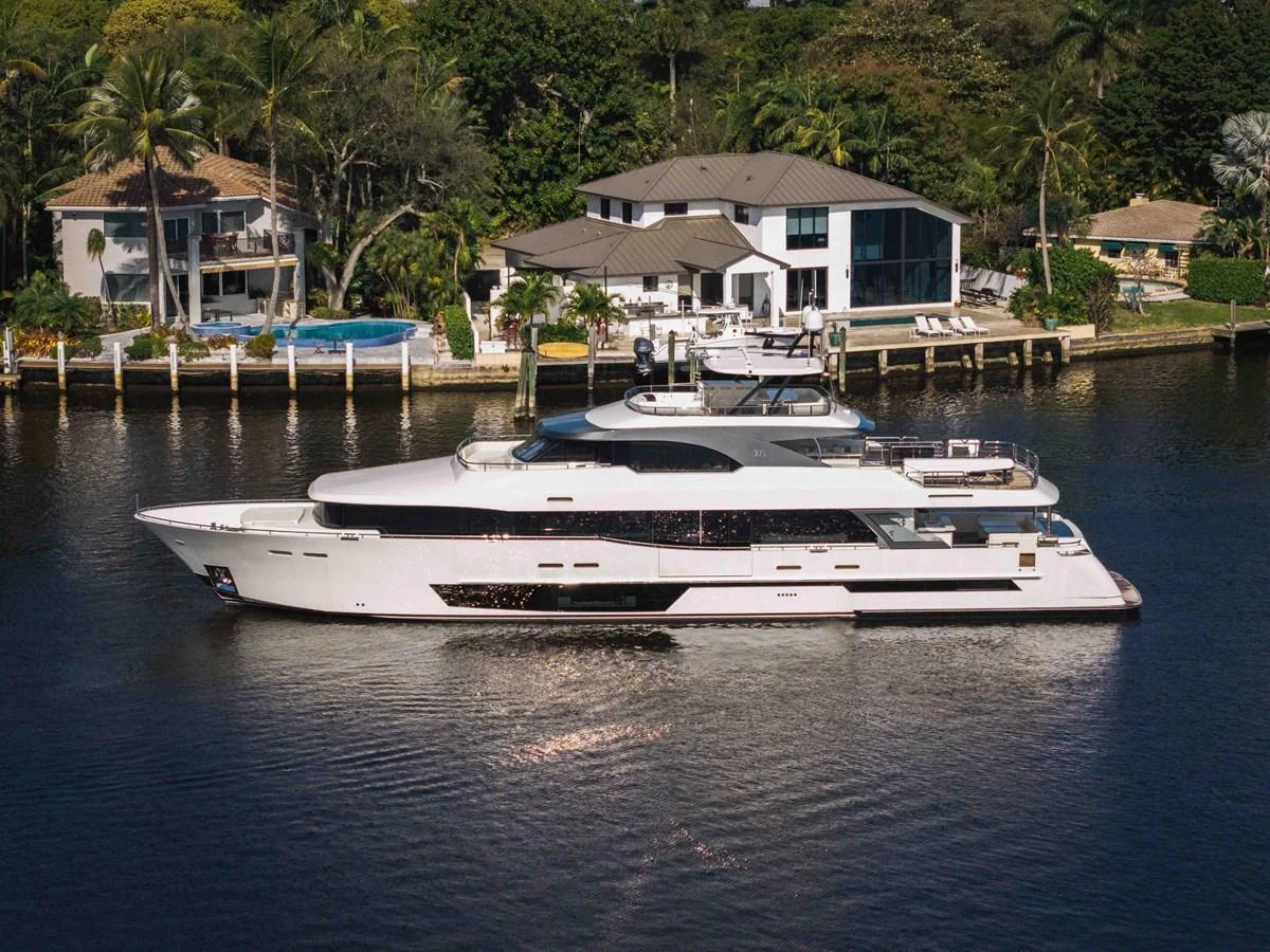 A sleek and modern yacht cruises gracefully along a serene waterfront, showcasing its elegant design and luxurious amenities. aboard OCEAN ALEXANDER 37L Yacht for Sale