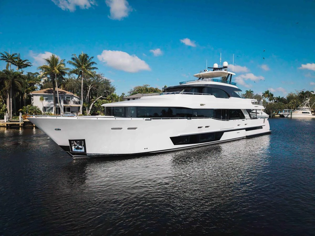 A sleek and modern yacht glides gracefully on calm waters under a clear blue sky. aboard OCEAN ALEXANDER 37L Yacht for Sale