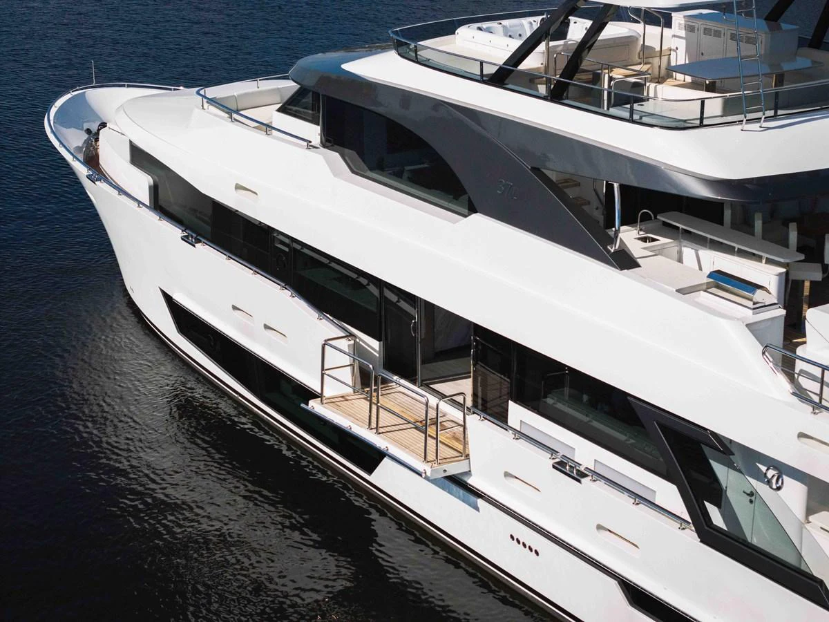 A sleek and modern yacht with a pristine white exterior, cruising on calm waters. aboard OCEAN ALEXANDER 37L Yacht for Sale