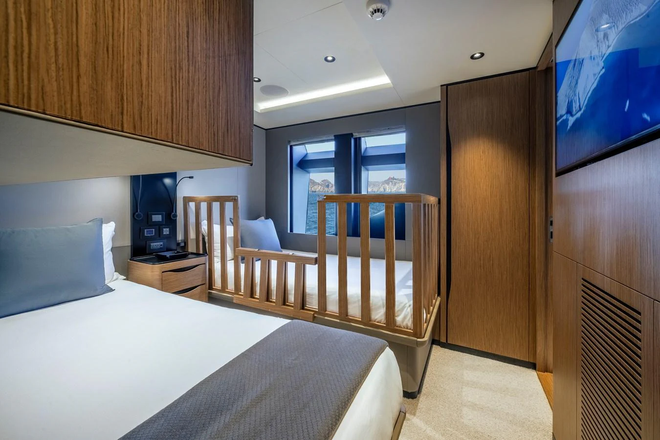 The guest stateroom features twin beds with a modern, elegant design and ample natural light. aboard SPRITZ 116 Yacht for Sale