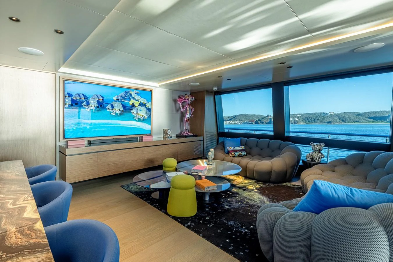 The salon features modern furnishings with panoramic views of the sea. aboard SPRITZ 116 Yacht for Sale