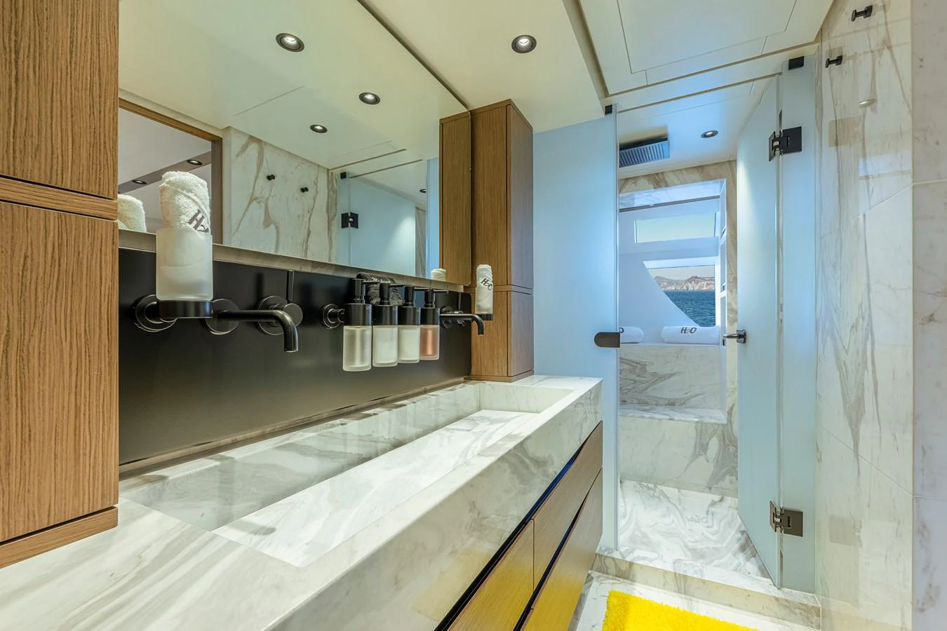 The yacht's bathroom features a sleek, modern design with luxurious marble finishes and high-end fixtures. aboard SPRITZ 116 Yacht for Sale